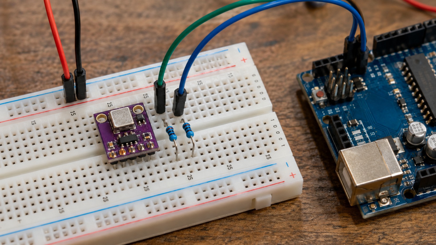 Bench photograph of an SHT30 breakout, two pull-up resistors and an Arduino on a breadboard